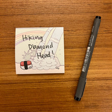 Load image into Gallery viewer, Musubi sticky note with a waterfall in the background
